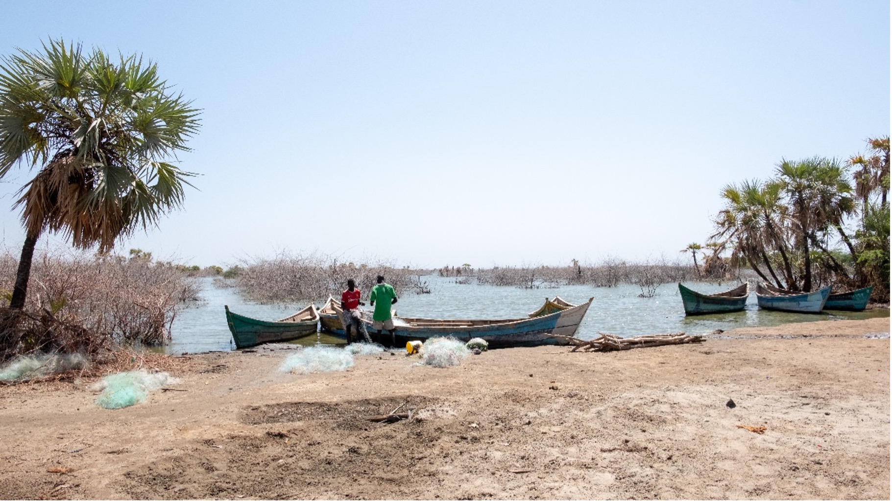 Fishermen preparing their nets before going out to fish in Impresa beach, Kalokol town