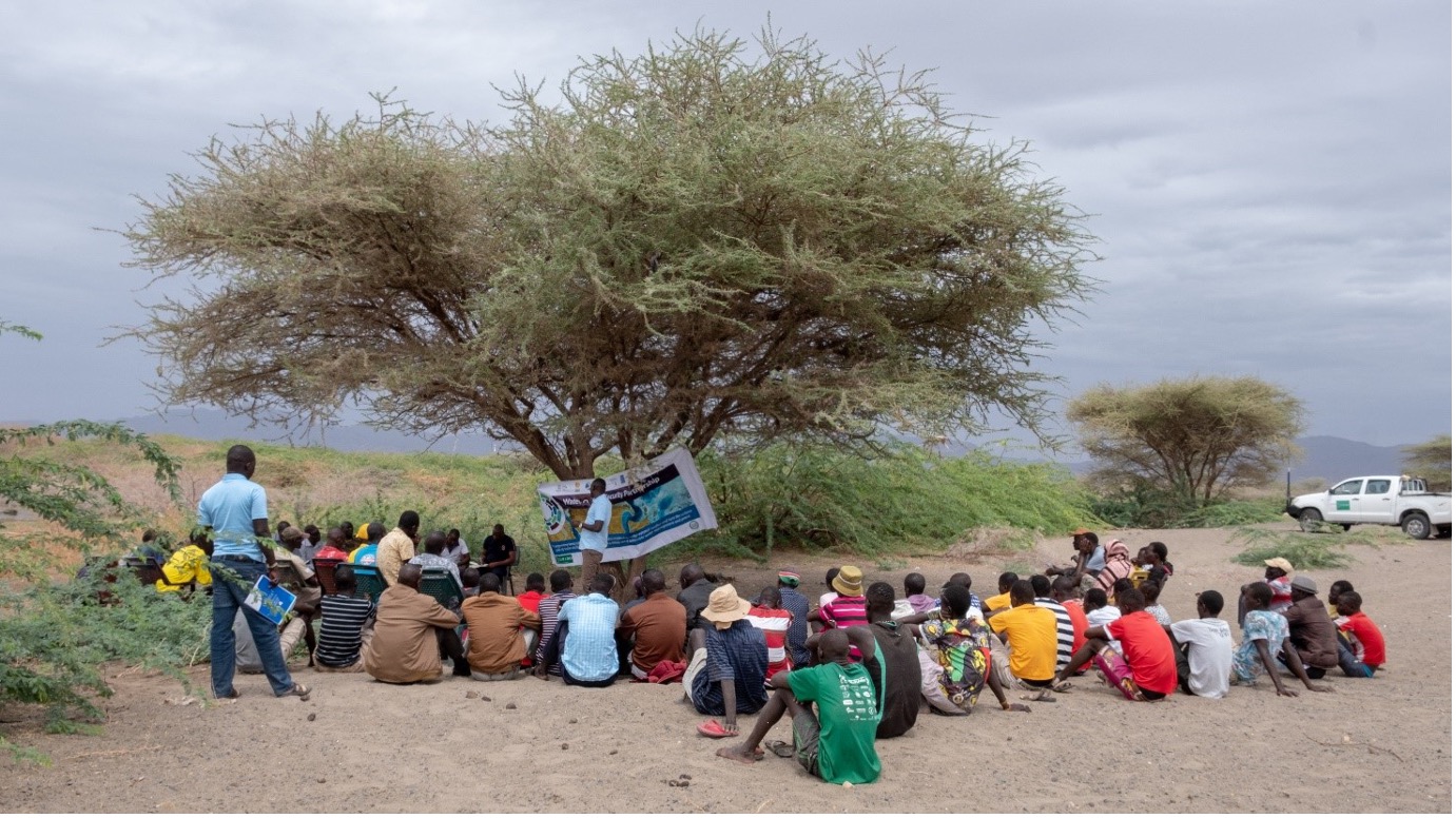 Dickson Lowoi, from the local WPS partner TUPADO, addressing the BMUs meeting at Lowareng'ak beach with KWS, fisheries and Maritime officials to talk over their issues