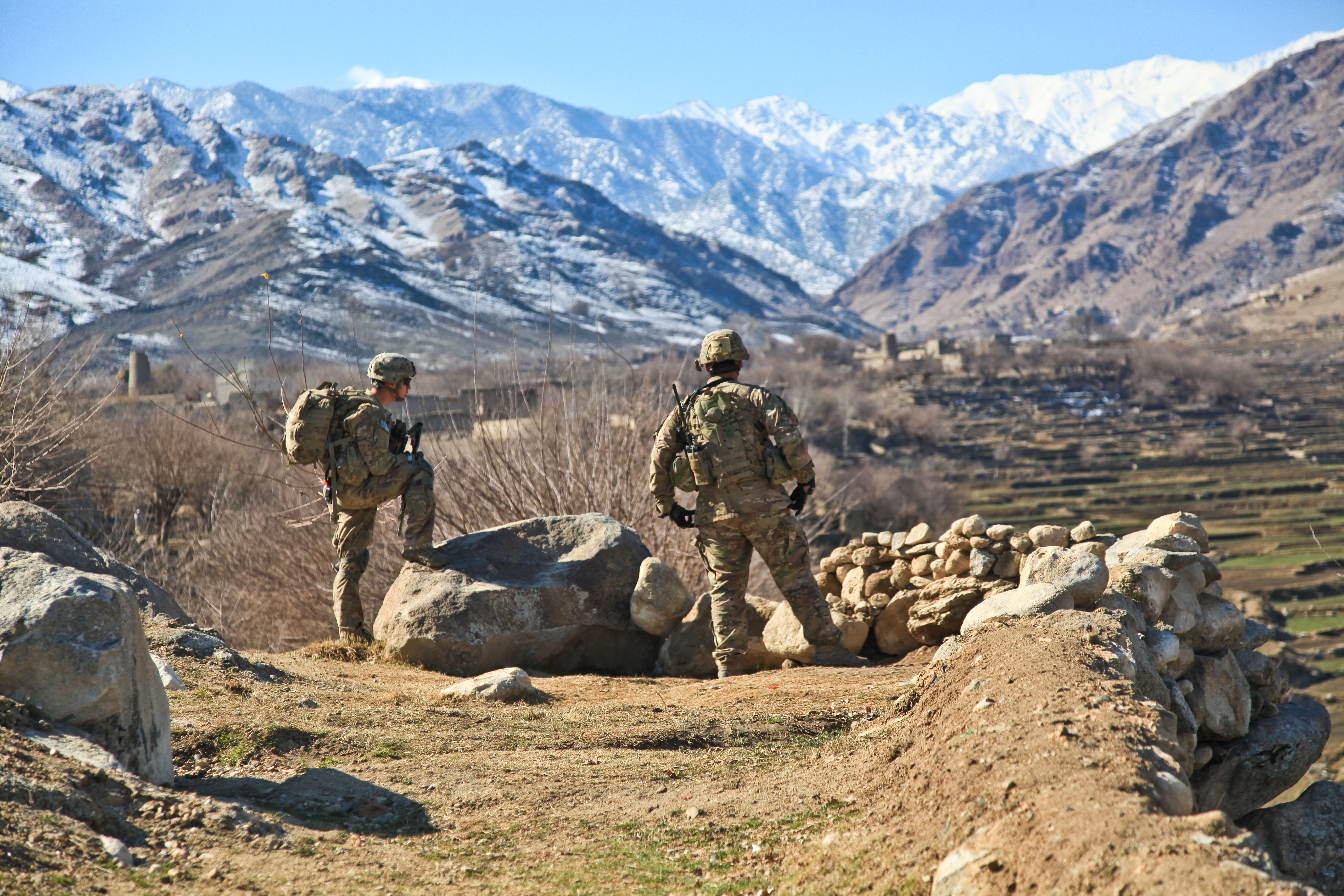 Two US soldiers overlooking Afghan valley