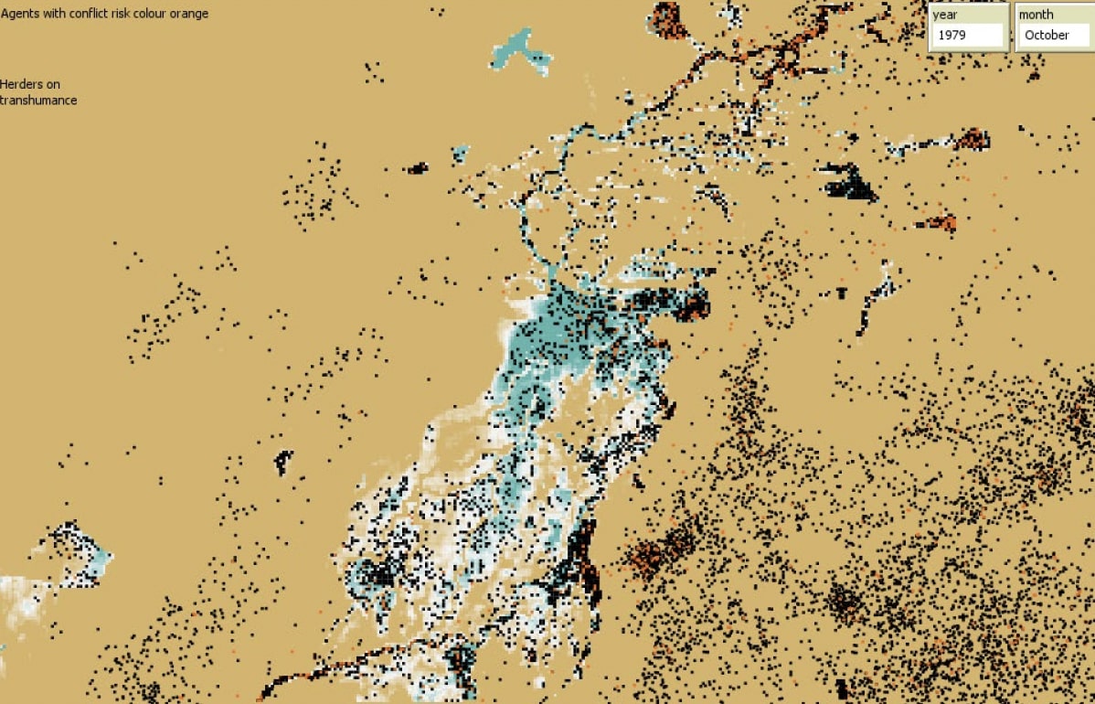 Snapshot of the modelled ‘world’. The black dots are the agents. Agents with a risk of conflict colour orange. The water
depth of the IND is visualized with green-blue-white colours. The darker the colour, the deeper the water. The year and month are
displayed in the top-right.