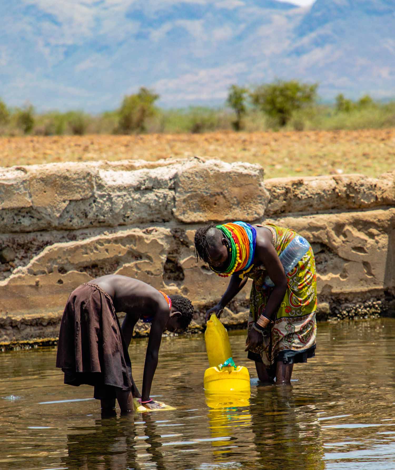 Two Kenyans fetching water
