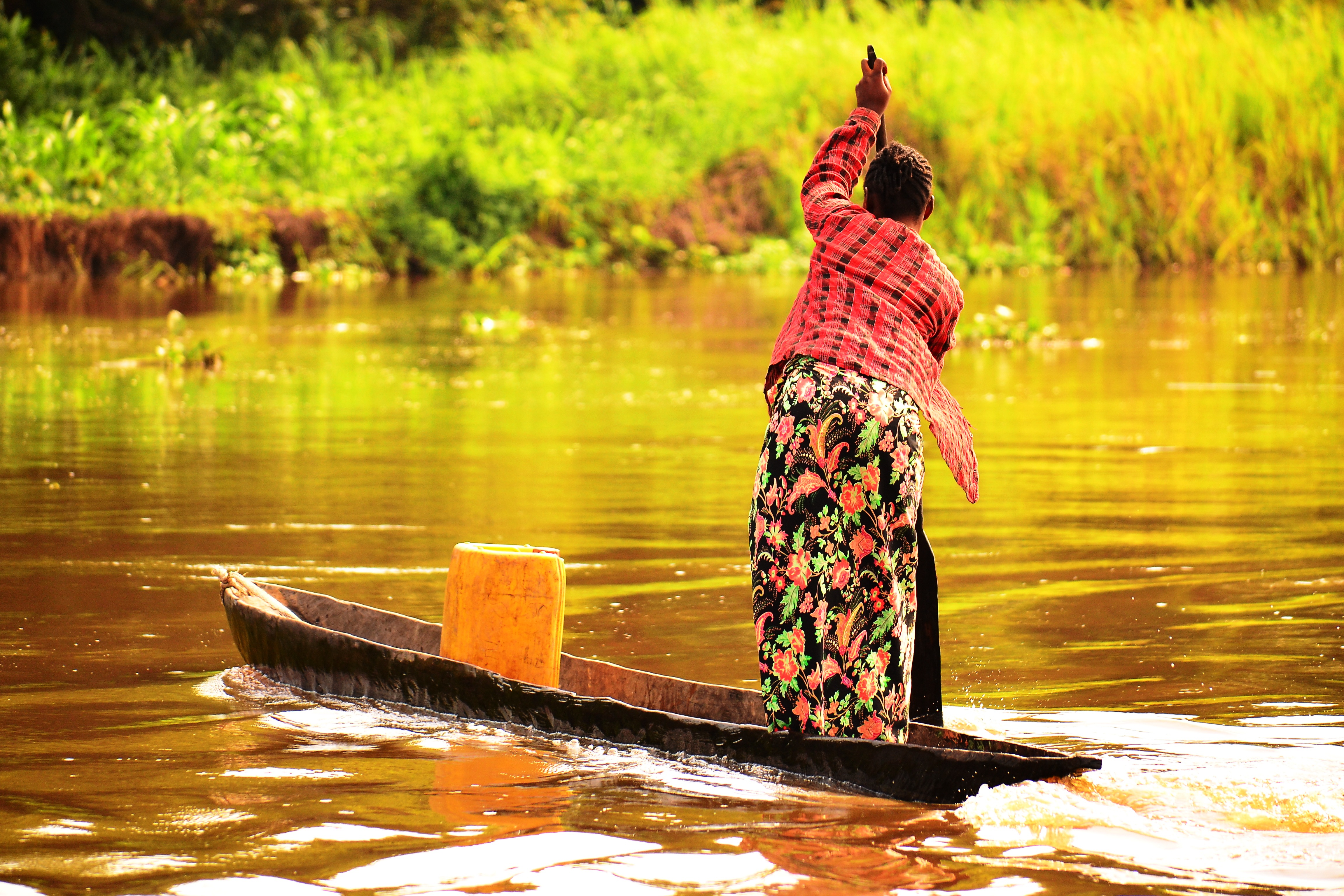 Woman on boat in river Congo